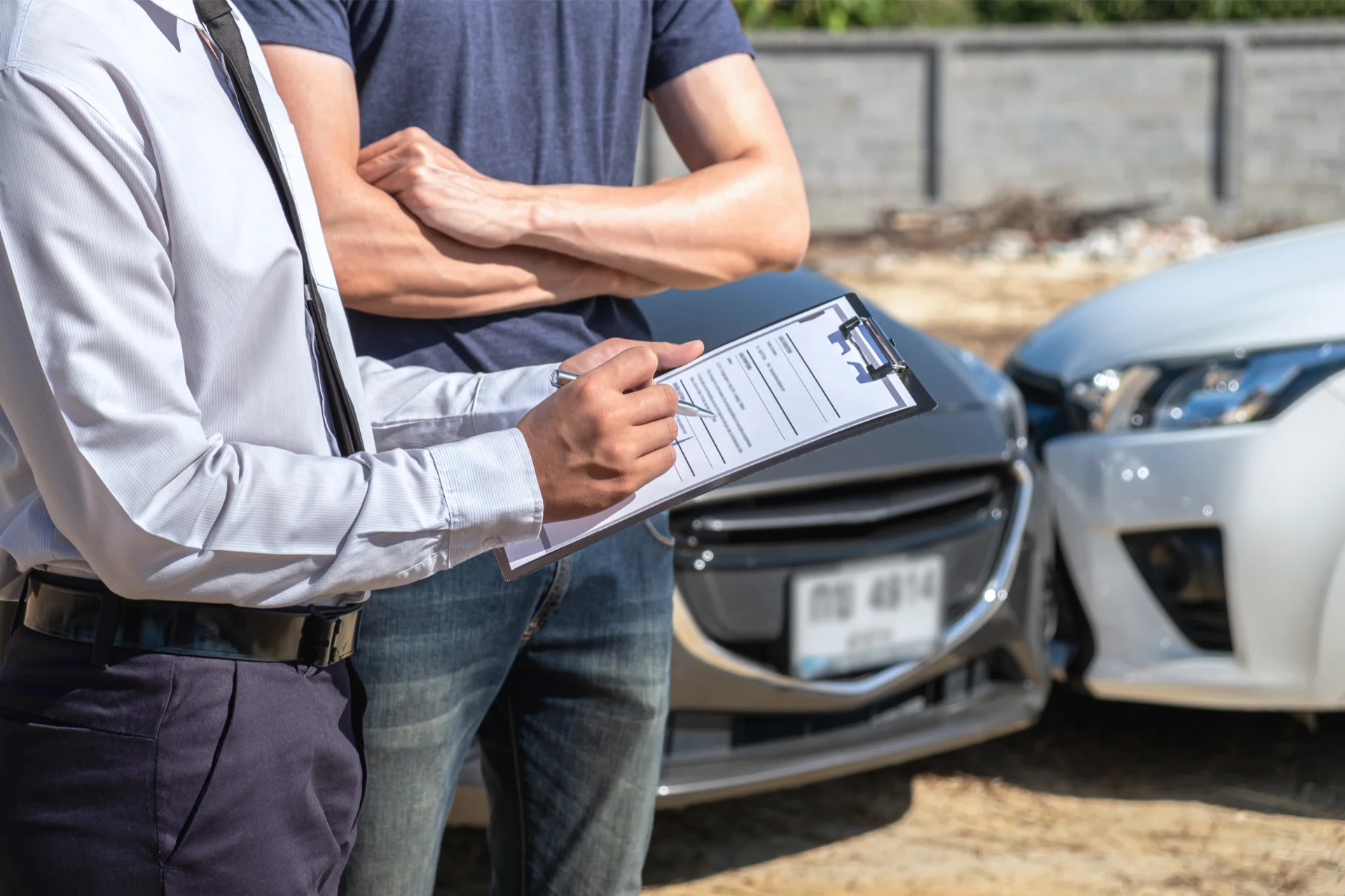 A lawyer for auto accident examining car damages