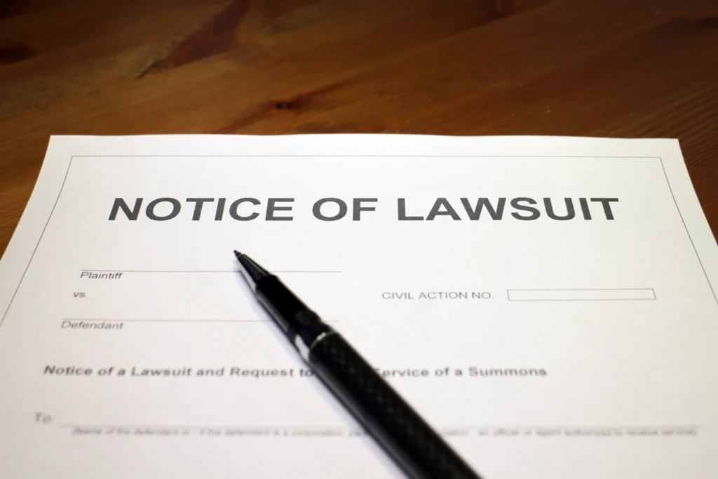 A form of a dog bite lawsuit on a desk