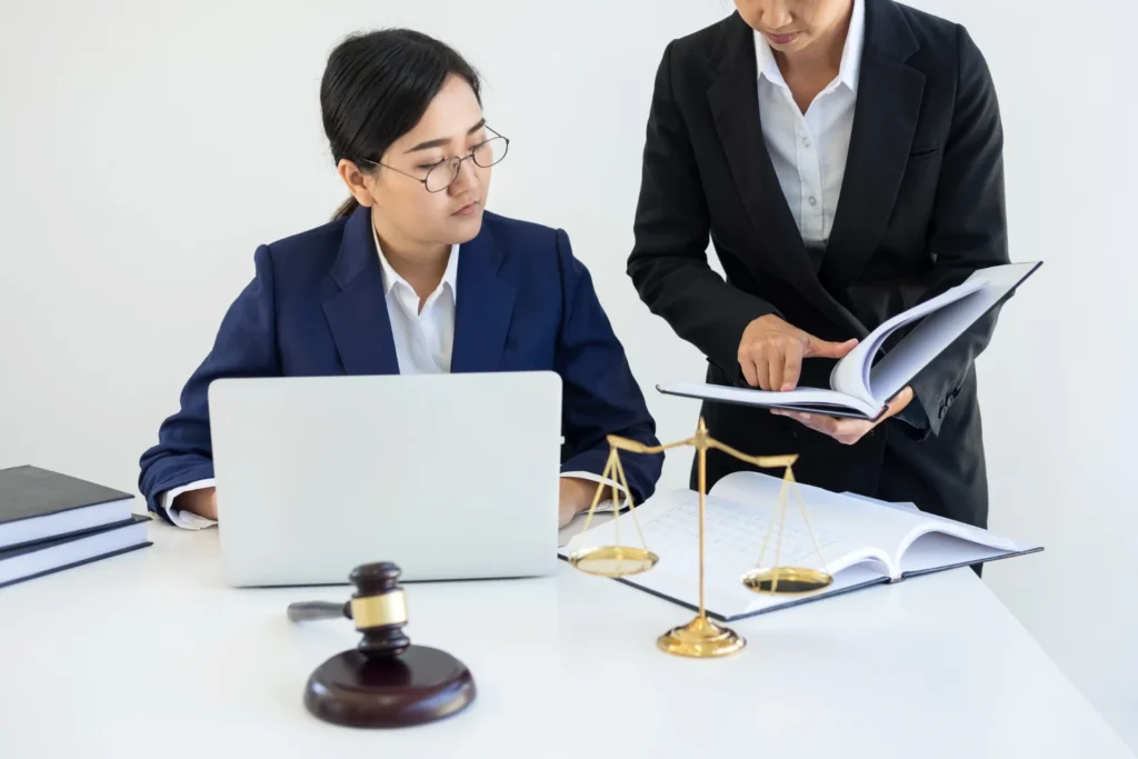 Two lawyers discussing product liability cases