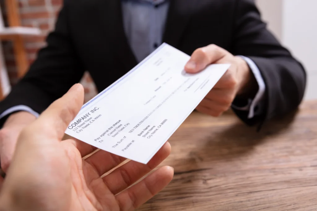 A lawyer giving a pip check to a client