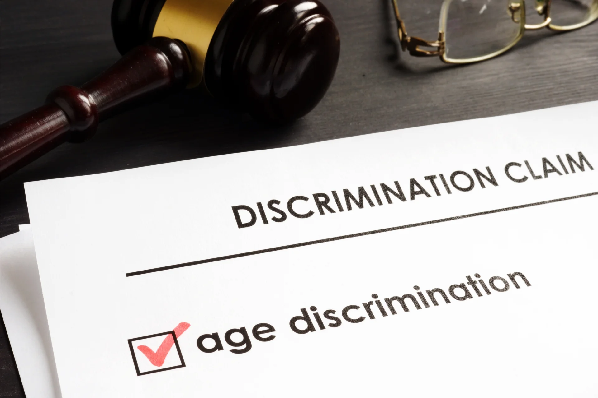 An age discrimination claim form on a lawyers desk