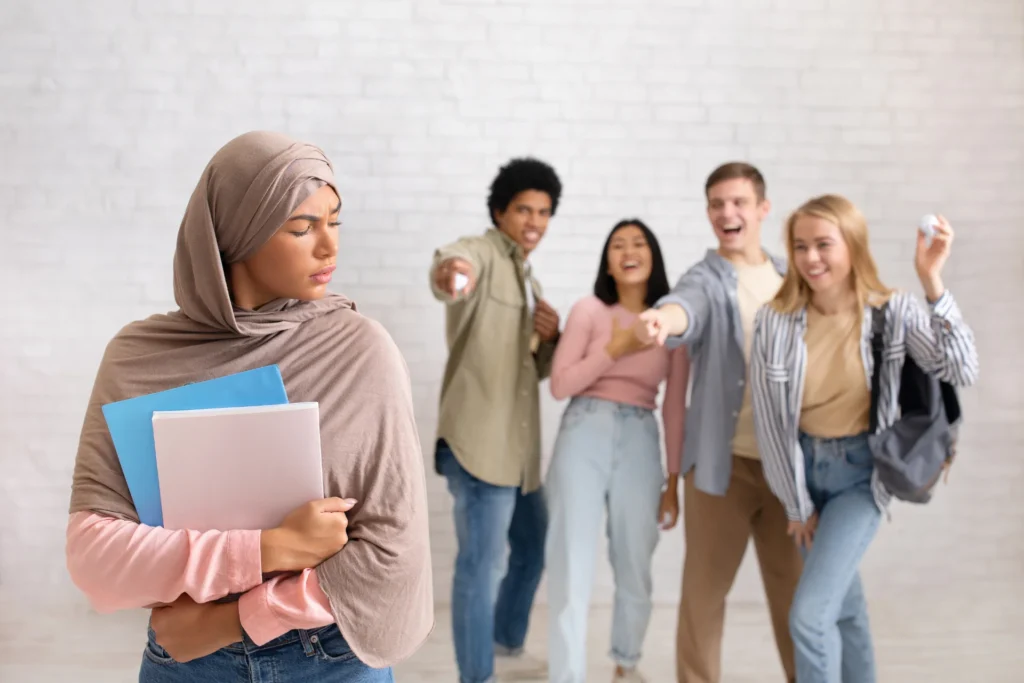 Woman suffering from religious discrimination by coworkers
