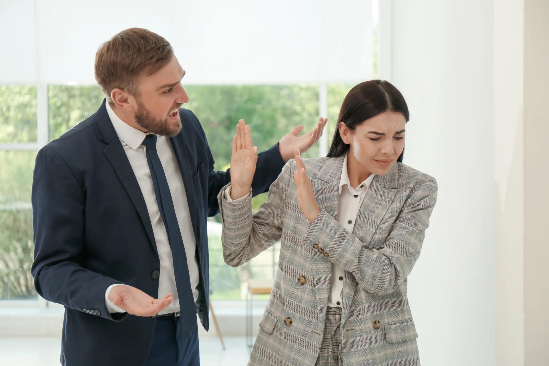 Sexism in the workplace with a man screaming at a woman