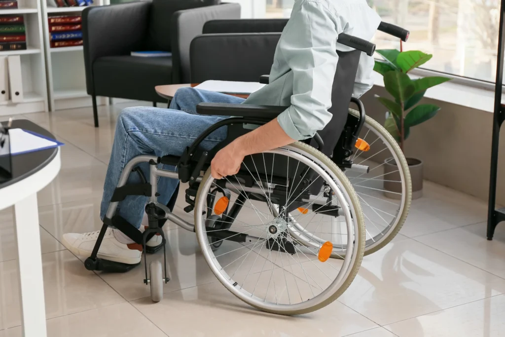 Man in wheelchair because of spinal cord injury