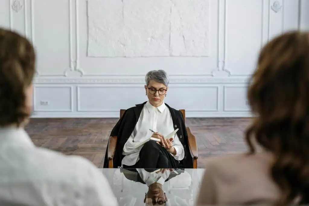 Two people mediating in front of a divorce lawyer