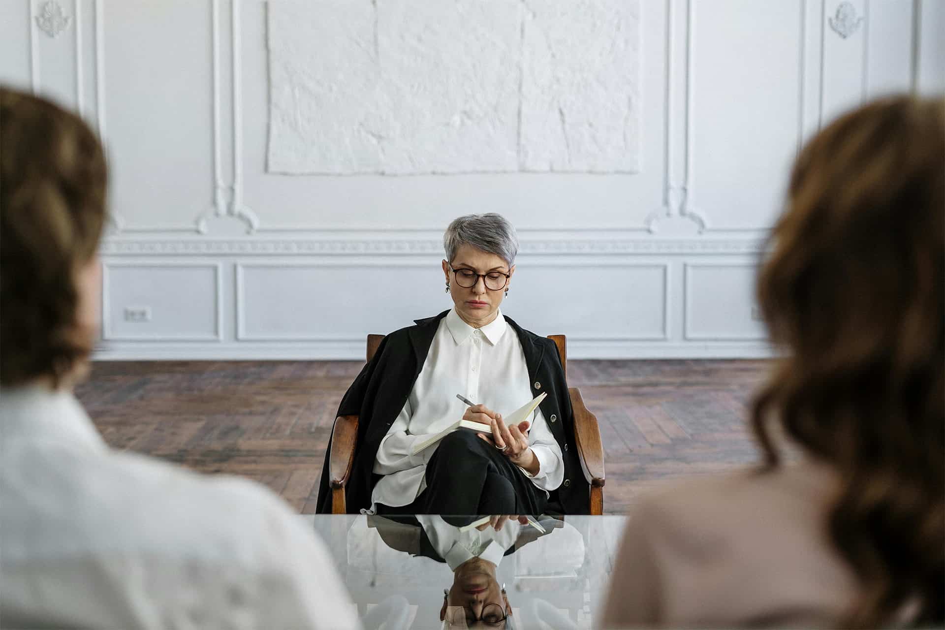 Two people mediating in front of a divorce lawyer